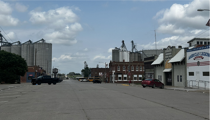 an image of a street with silos on the left and businesses on the right