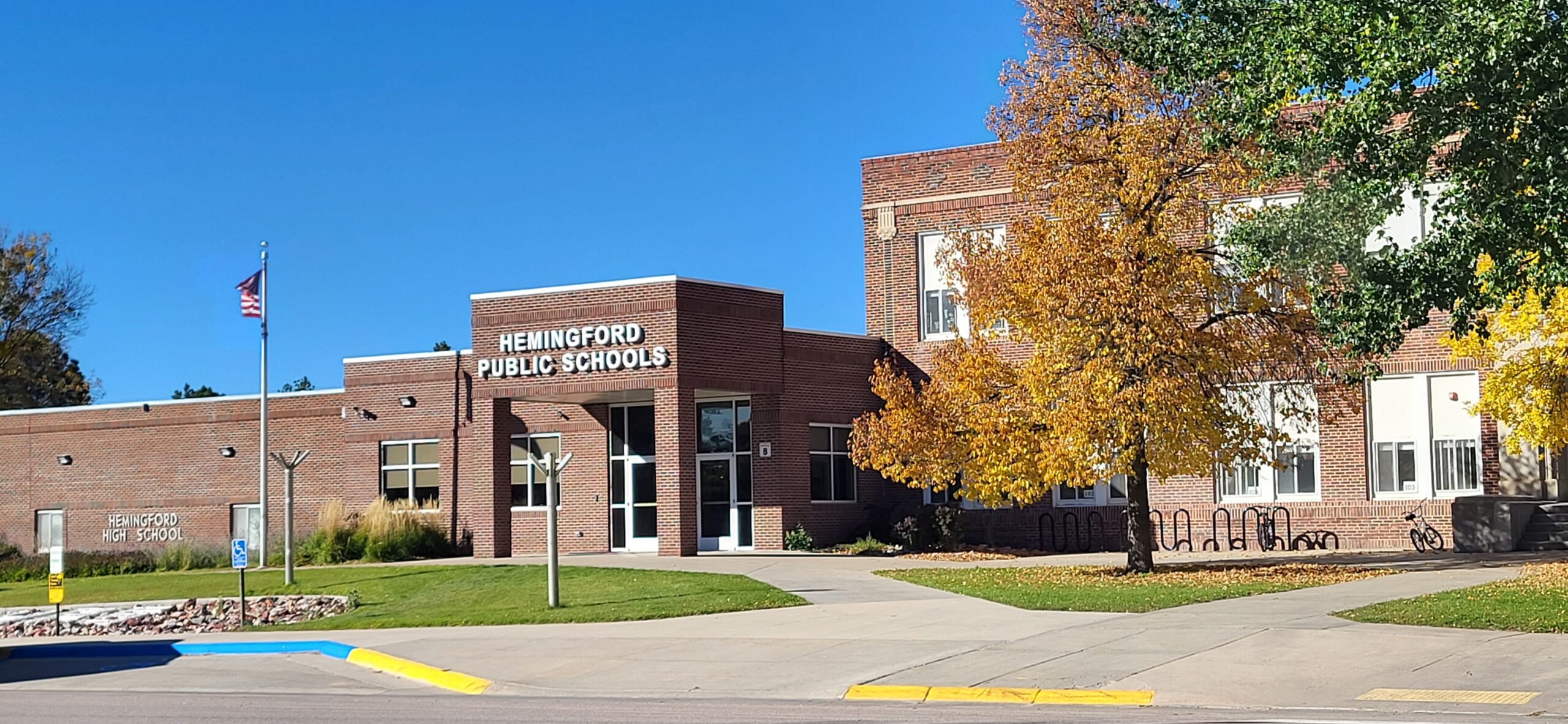 an image of a street with silos on the left and businesses on the right