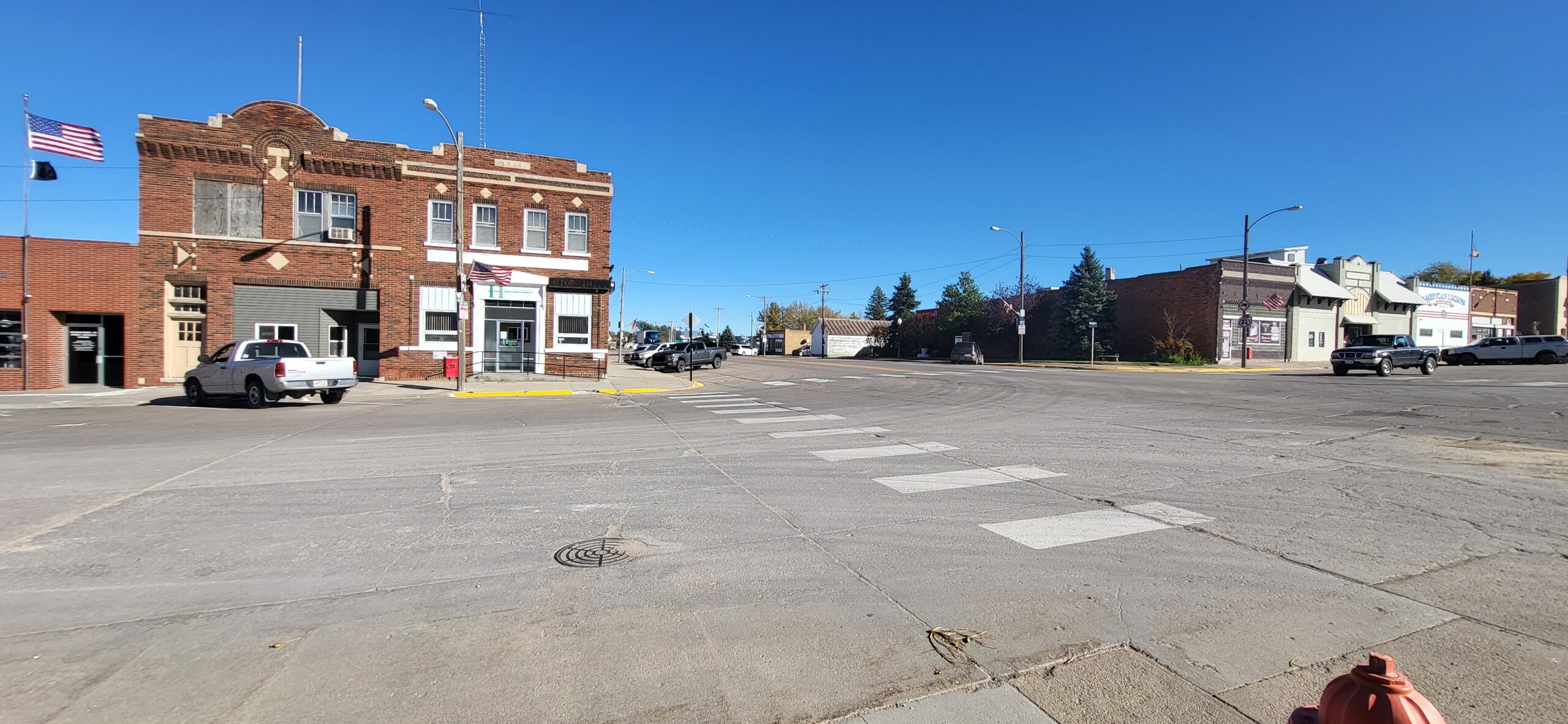 an image of a street with clouds overhead