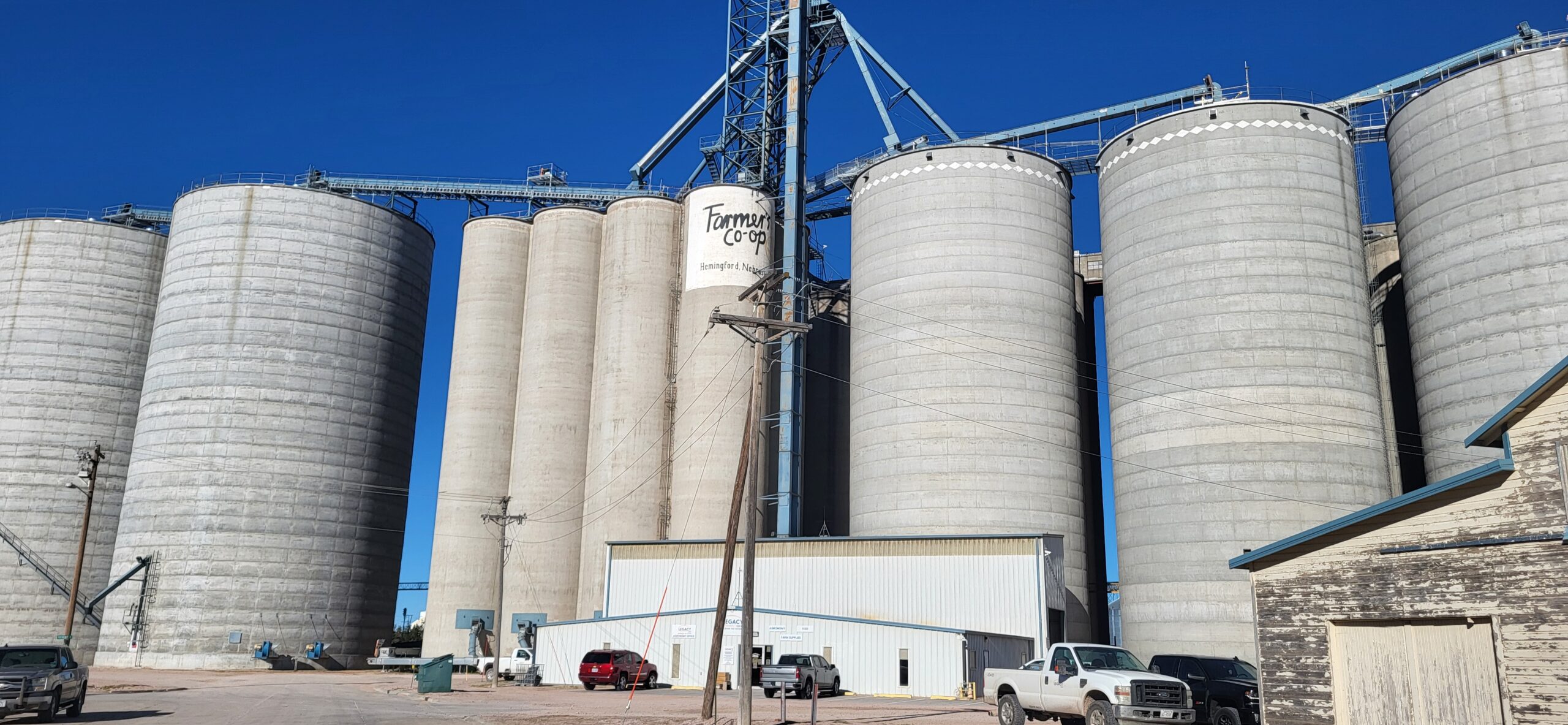 a road over slightly sloping hills taken at sunset